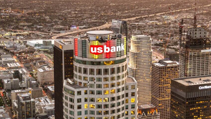 Los Angeles, California, USA - March 23, 2016: Aerial view of the Us Bank Tower and sign in the Los Angeles downtown, Is visible also an helicopter flying around the tower.