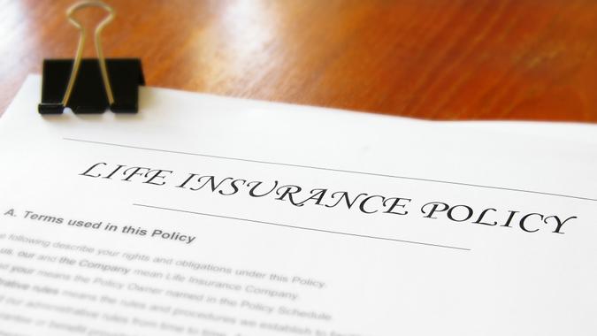16 Most Important Assets That Will Increase Your Net Worth, closeup of a life insurance policy on a desk
