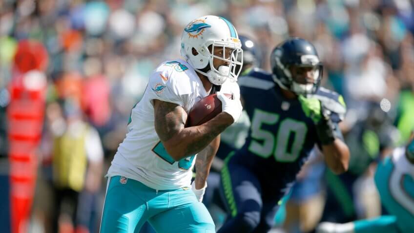 SEATTLE, WA - SEPTEMBER 11: Running back Arian Foster #29 of the Miami Dolphins rushes against the Seattle Seahawks in the first quarter at CenturyLink Field on September 11, 2016 in Seattle, Washington.