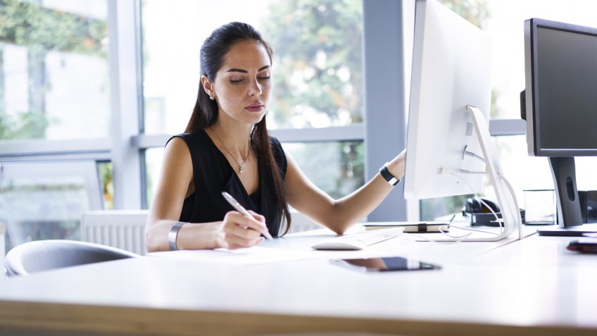 96 Money-Making Skills You Can Learn in Less Than a Year, Concentrated professional female journalist making researches on