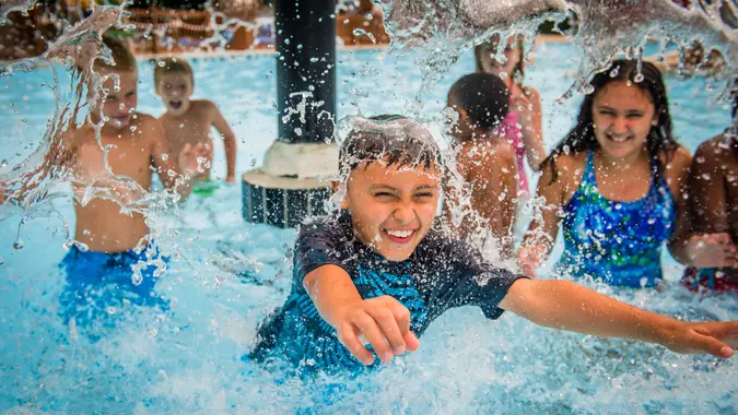 Children splash and play in the waters of Rock ÔNÕ Roll Island at Water Country USA¨.
