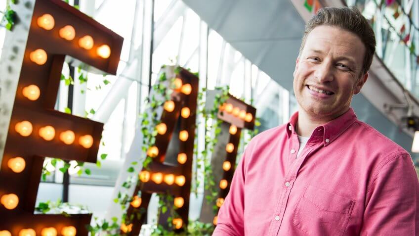 LONDON, ENGLAND - MAY 16: Jamie Oliver broadcasts a live cooking class from City Hall to school children across the globe as part of the third annual Food Revolution Day on May 16, 2014 in London, England.