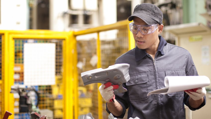 96 Money-Making Skills You Can Learn in Less Than a Year, Mechanic worker checking for defects on metal