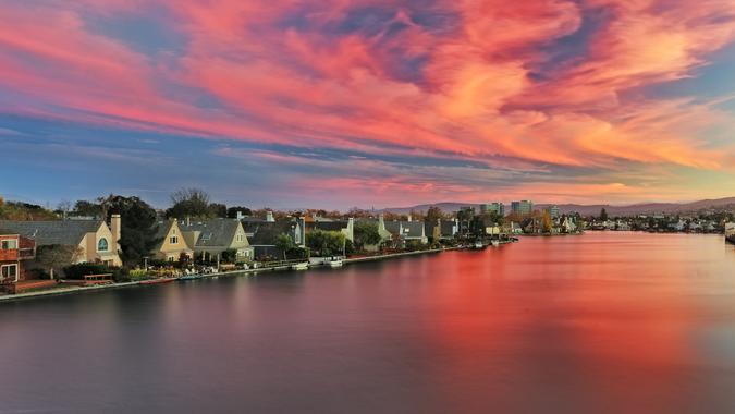 Panoramic view of award winning houses on lagoon, Oracle world headquarters in cylindrical shape buildings, Fog on Belmont hills to name a few.