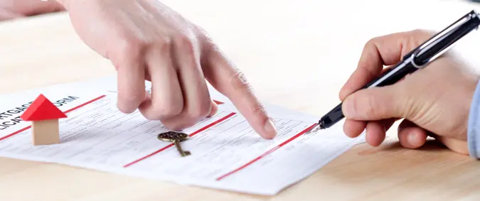 New homeowner signing contract of house sale or mortgage papers.