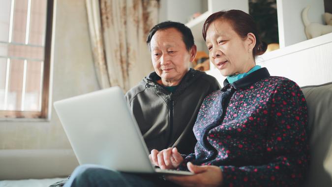 Senior couple with computer.