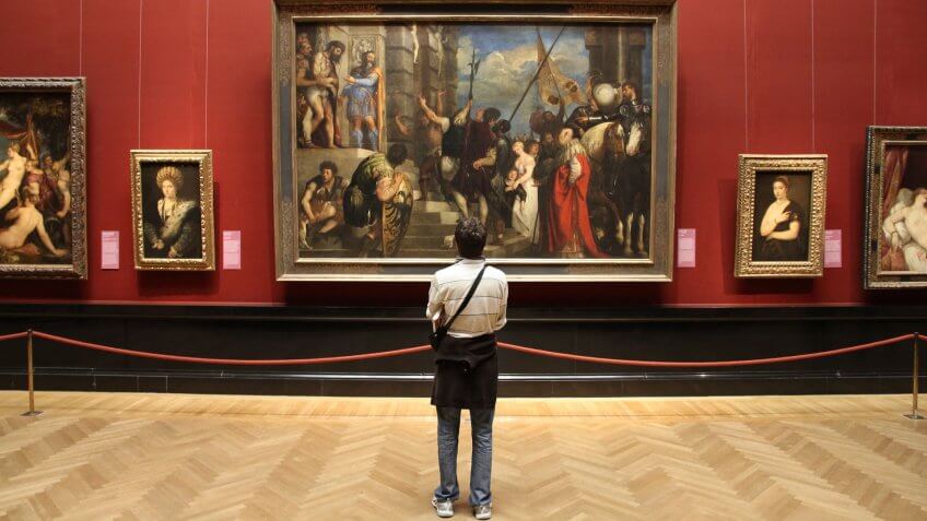 VIENNA, AUSTRIA - SEPTEMBER 8, 2011: Tourist admires art in Museum of Art History in Vienna.