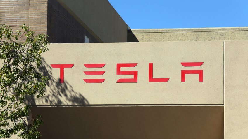 2014. Tesla Motors is an American company that designs, CA - MARCH 18: The Tesla Motors World Headquarters located in Pa, PALO ALTO, manufactures and sells electric cars.