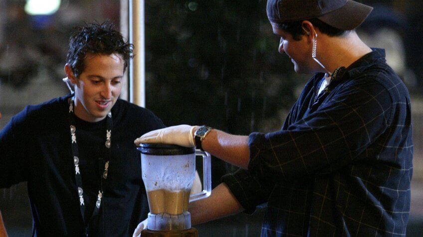 NEW YORK - JULY 12: Fear Factor employee Josh Silverman does a taste test of blended rat for the second stunt in Times Square to celebrate the show's 100th episode July 12, 2004 in New York City.