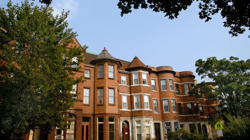 "Angled, framed row of houses on St.
