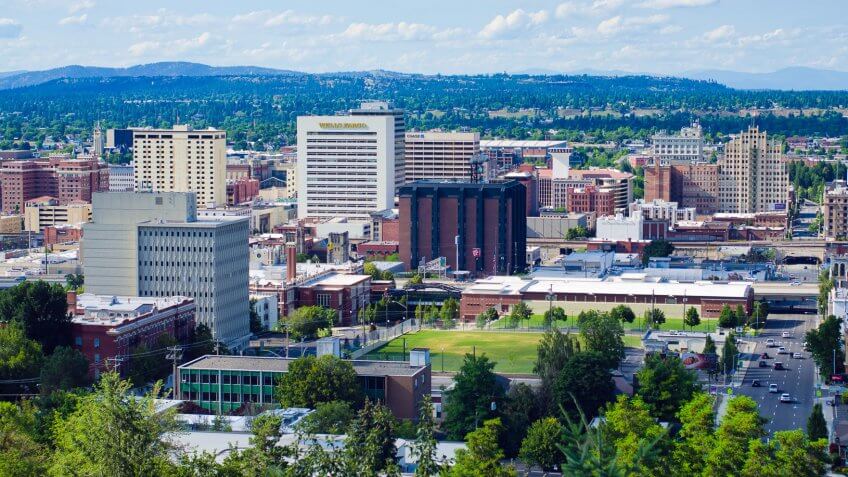 "Spokane, United States - July 21, 2012: View of downtown Spokane and several of its office buildings, as seen from an elevated viewpoint along the South Hill.