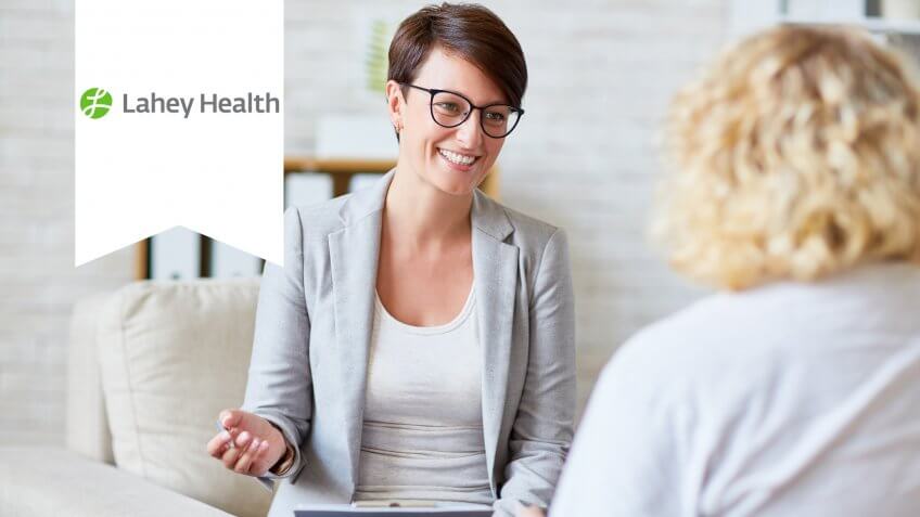 Successful psychologist talking to her patient.