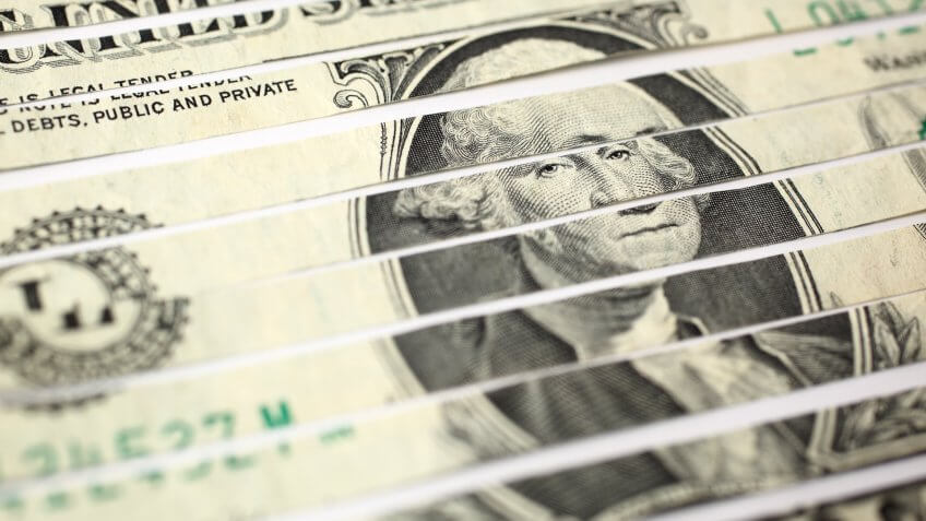Close-up of shredded US one dollar bill.