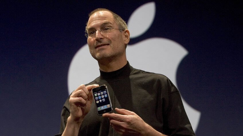 SAN FRANCISCO, CA - JANUARY 9: Apple CEO Steve Jobs holds up the new iPhone that was introduced at Macworld on January 9, 2007 in San Francisco, California.