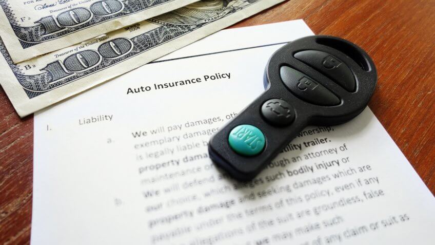 Car insurance policy with key fob and cash