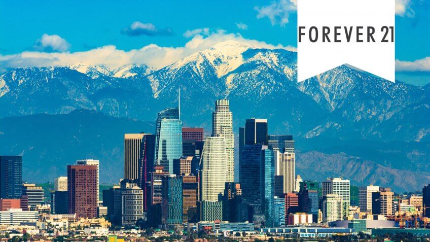 Downtown Los Angeles with the new Wilshire Grand skyscraper, Los Angeles’ tallest building by pinnacle, and with the snow-capped San Gabriel Mountains in the background.