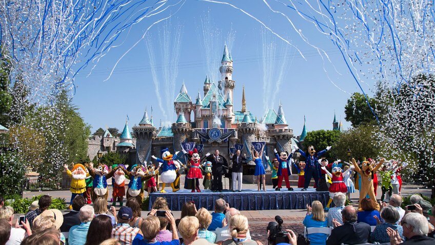 ANAHEIM, CA - JULY 17: In this handout photo provided by Disney parks, Mickey Mouse and his friends celebrate the 60th anniversary of Disneyland park during a ceremony at Sleeping Beauty Castle featuring Academy Award-winning composer, Richard Sherman and Broadway actress and singer Ashley Brown July 17, 2015 in Anaheim, California.