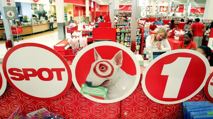 ALBANY, CA - MAY 15: Customers check out at cash registers in a Target store May 15, 2006 in Albany, California.