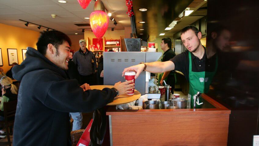 EDWARDS, CO- NOVEMBER 21: USA Ski Team member Toby Dawson gets a coffee from Starbucks near his home in Edwards, Colorado on November 21, 2005.