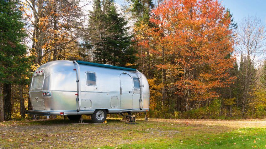 Retro style stainless steel caravan in American outdoors.