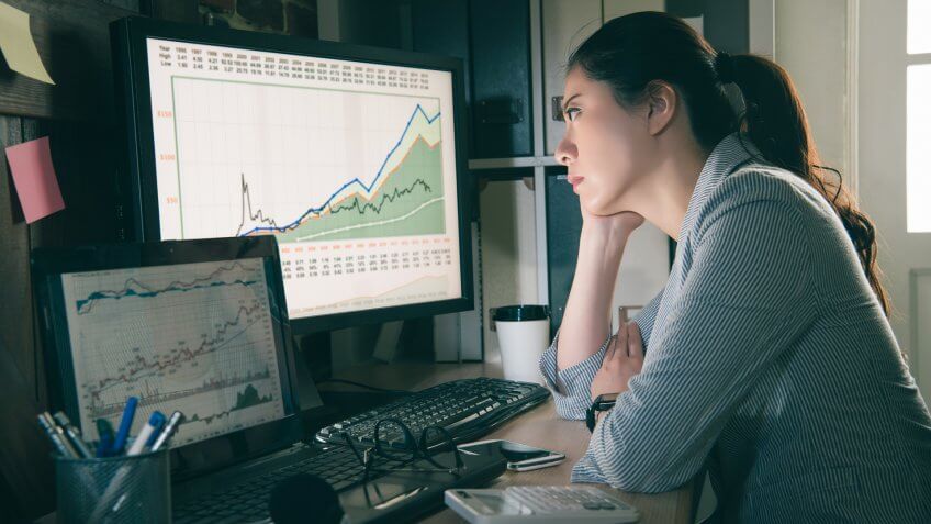 stock agent watching the computer.