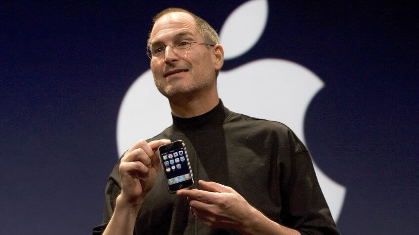 SAN FRANCISCO, CA - JANUARY 9: Apple CEO Steve Jobs holds up the new iPhone that was introduced at Macworld on January 9, 2007 in San Francisco, California.