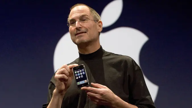 SAN FRANCISCO, CA - JANUARY 9: Apple CEO Steve Jobs holds up the new iPhone that was introduced at Macworld on January 9, 2007 in San Francisco, California.