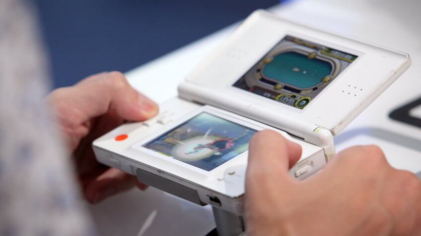 CHIBA, JAPAN - SEPTEMBER 16: A visitor plays Namco Bandai Games Inc.