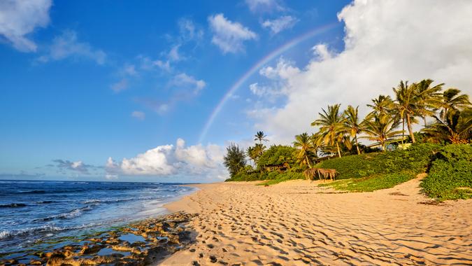 Hawaii: Sunset Beach rainbow scenic view over the popular surfing place Sunset Beach, North Shore, Oahu, Hawaii, USA.