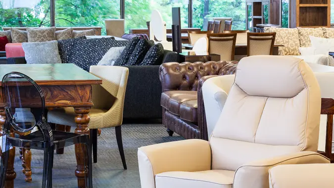 Used furniture on display inside a store to represent secondhand shopping.