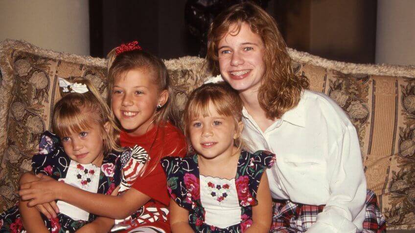 LOS ANGELES, CALIFORNIA - exact date unknown - circa 1990 - Mary Kate Olsen, Ashley Olsen, Jodie Sweetin and Andrea Barber of the sitcom Full House posing at charity event.