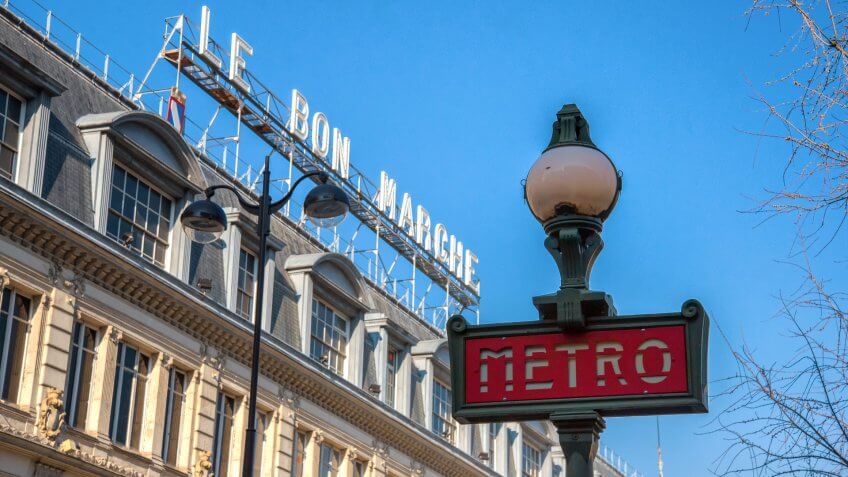 Metro station sign across the Le Bon Marche department store on February 19, 2013.