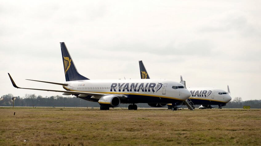 BISHOP'S STORTFORD, ENGLAND - FEBRUARY 28: Planes sit on the runway at Stansted Airport on February 28, 2013 in Bishop's Stortford, England.