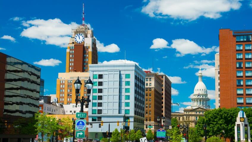 Lansing downtown skyline (with the Boji Tower on the right) with the Michigan State Capitol building in the back.