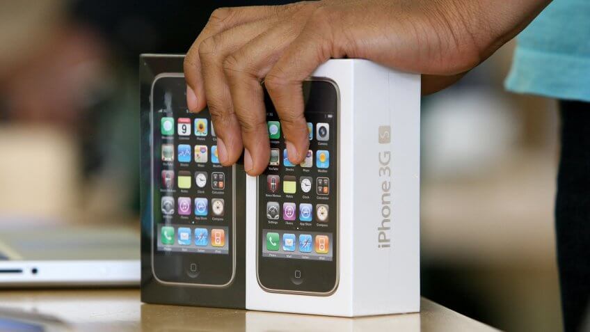 SAN FRANCISCO - JULY 21: An Apple Store sales associate prepares to sell two iPhone 3GS at an Apple Store July 21, 2009 in San Francisco, California.