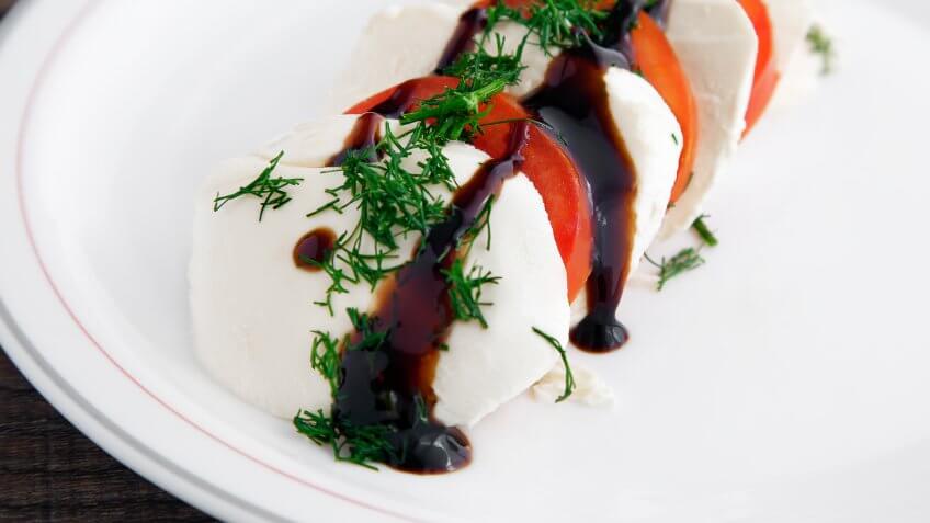 Italian Caprese Salad with a twist, adding dill and creamy Balsamic vinegar.