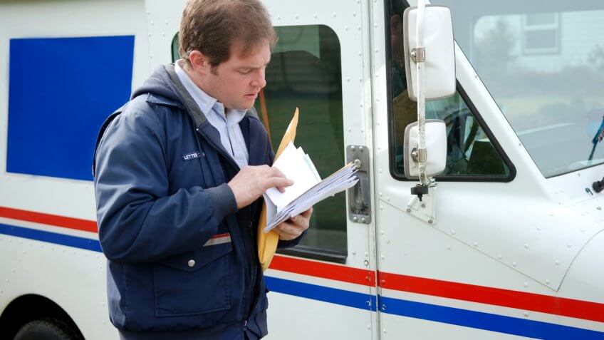 Mail Carrier Sorting the mail.