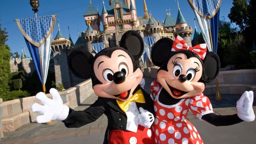 MICKEY & MINNIE -- Standing in front of Sleeping Beauty Castle at Disneyland, where magical storybooks come alive, Mickey Mouse and Minnie Mouse welcome visitors from all over the world.