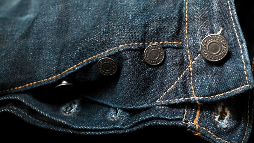Istanbul,Turkey - February 19,2015 : Close up of the Levi's denim jeans and its buttons and rivets which reflects it's ruggedness.