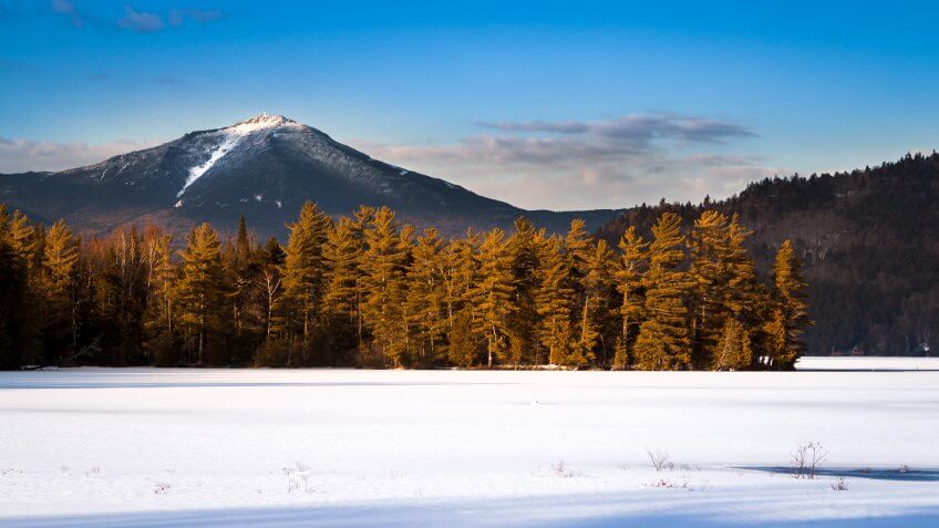 Whiteface mountain peak viewed from the frozen Paradox Bay in Lake Placid, Upstate New York.