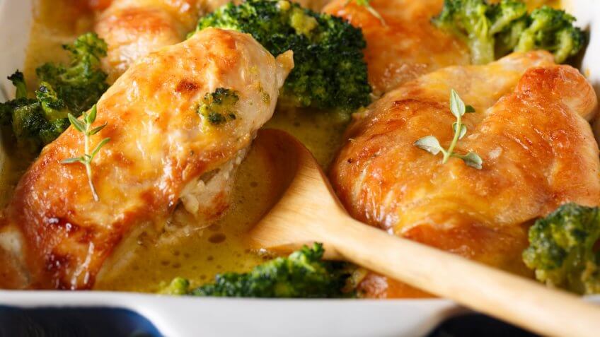 chicken fillet and broccoli baked in cheese sauce macro in a baking dish.