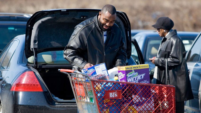 PHILADELPHIA - FEBRUARY 21: A customer loads his car after shopping at BJ's Wholesale Club February 21, 2007 in Philadelphia, Pennsylvania.