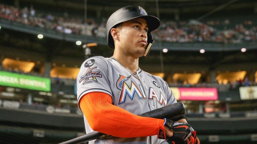 PHOENIX, AZ - SEPTEMBER 24: Giancarlo Stanton #27 of the Miami Marlins warms up on deck during the first inning of the MLB game against the Arizona Diamondbacks at Chase Field on September 24, 2017 in Phoenix, Arizona.