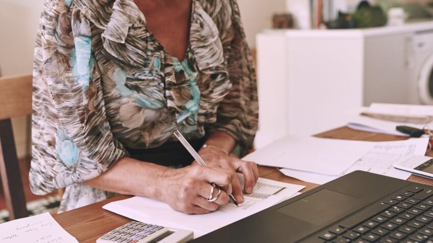 woman signing documents
