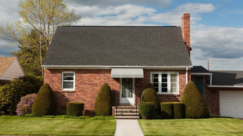 Facade of a brick bungalow.