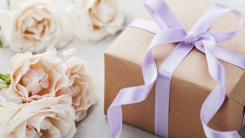 gift wrapped box and flowers