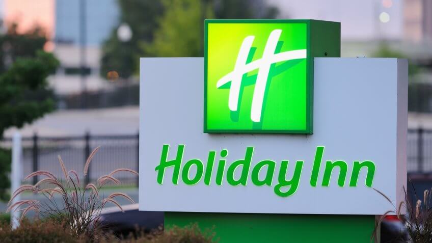 Huntsville, Alabama, USA - June 28, 2011: Close up of illuminated Holiday Inn sign at dusk.