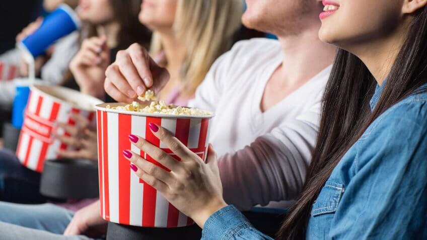 eating popcorn at the movies