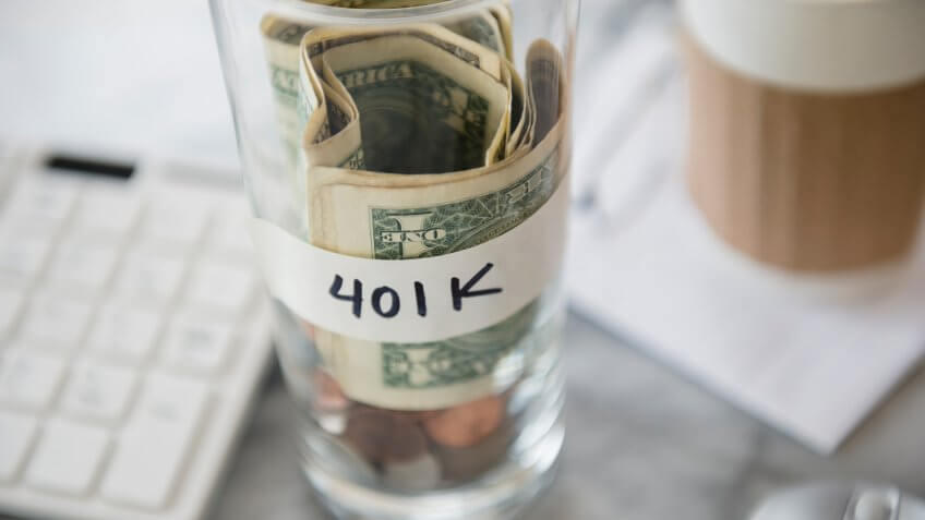 Close up of savings cup on office desk.