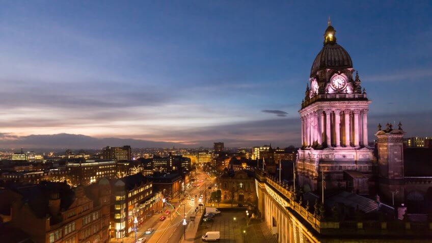 High angle view of Leeds Town Hall and panoramic night view of skyline, showing The Headrow and centre of the city.